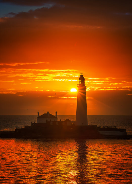 A golden sunrise by St. Mary’s Lighthouse.