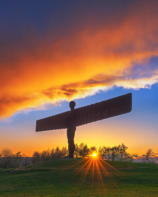 Golden sunset clouds at the Angel of the North.