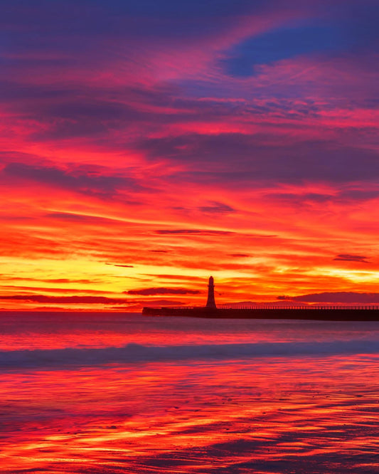Dramatic fire sky sunrise at Roker Beach