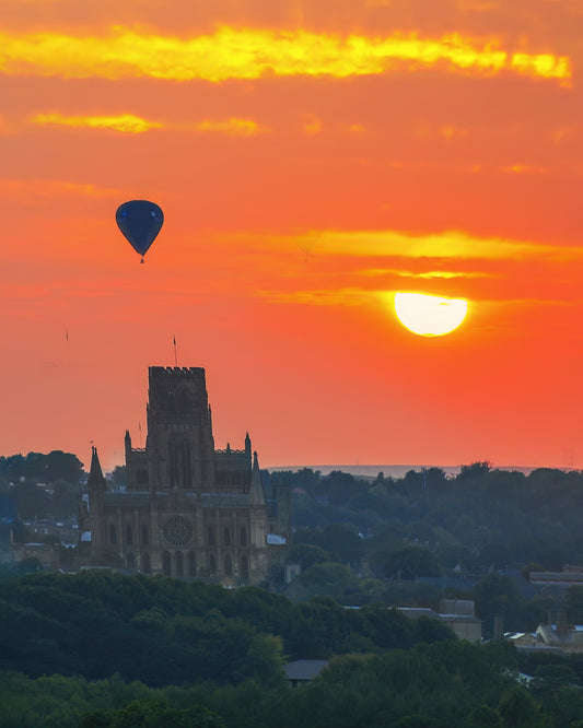 A Durham Cathedral sunset with a hot air balloon.