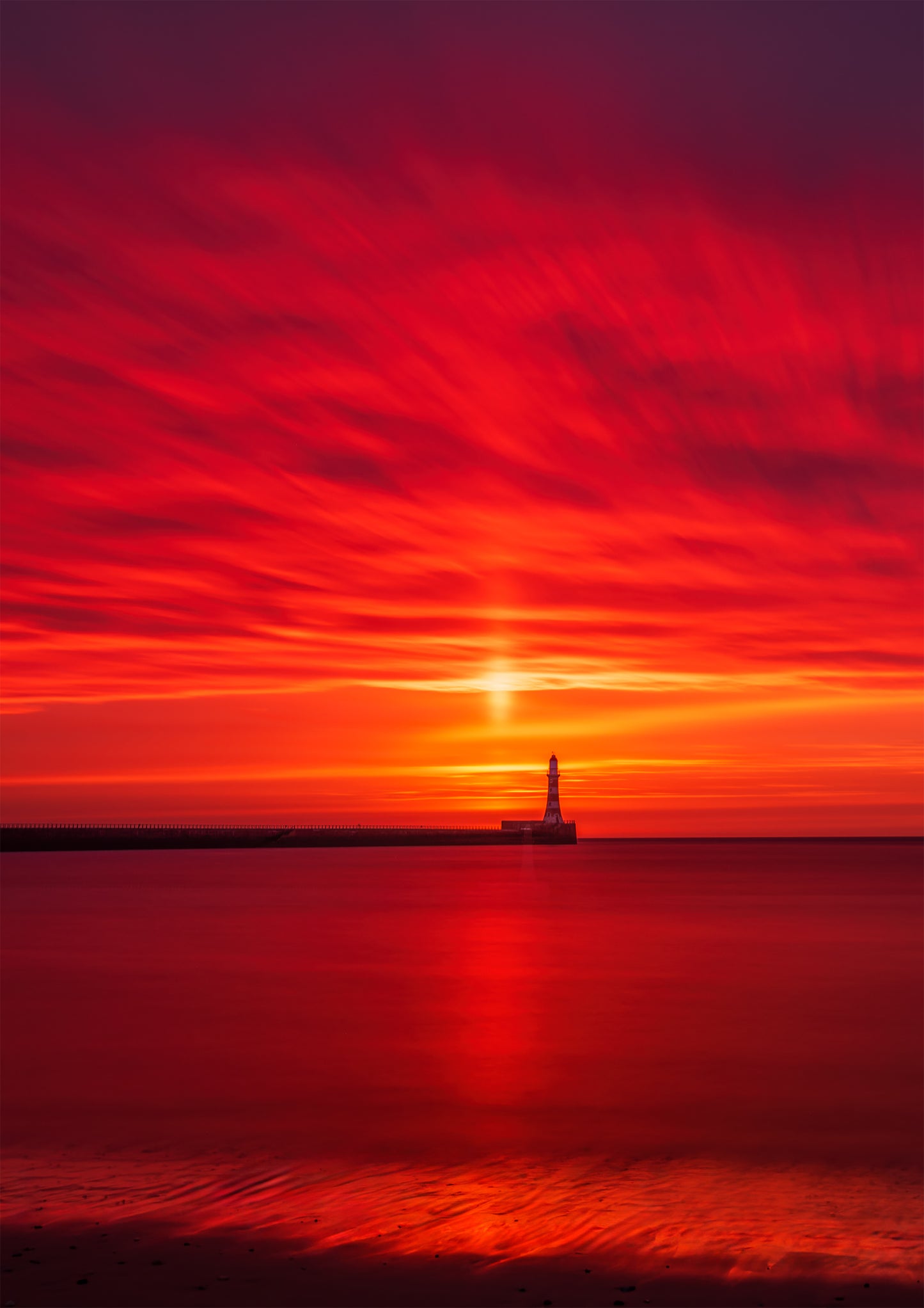 Long exposure fire sky at Roker.