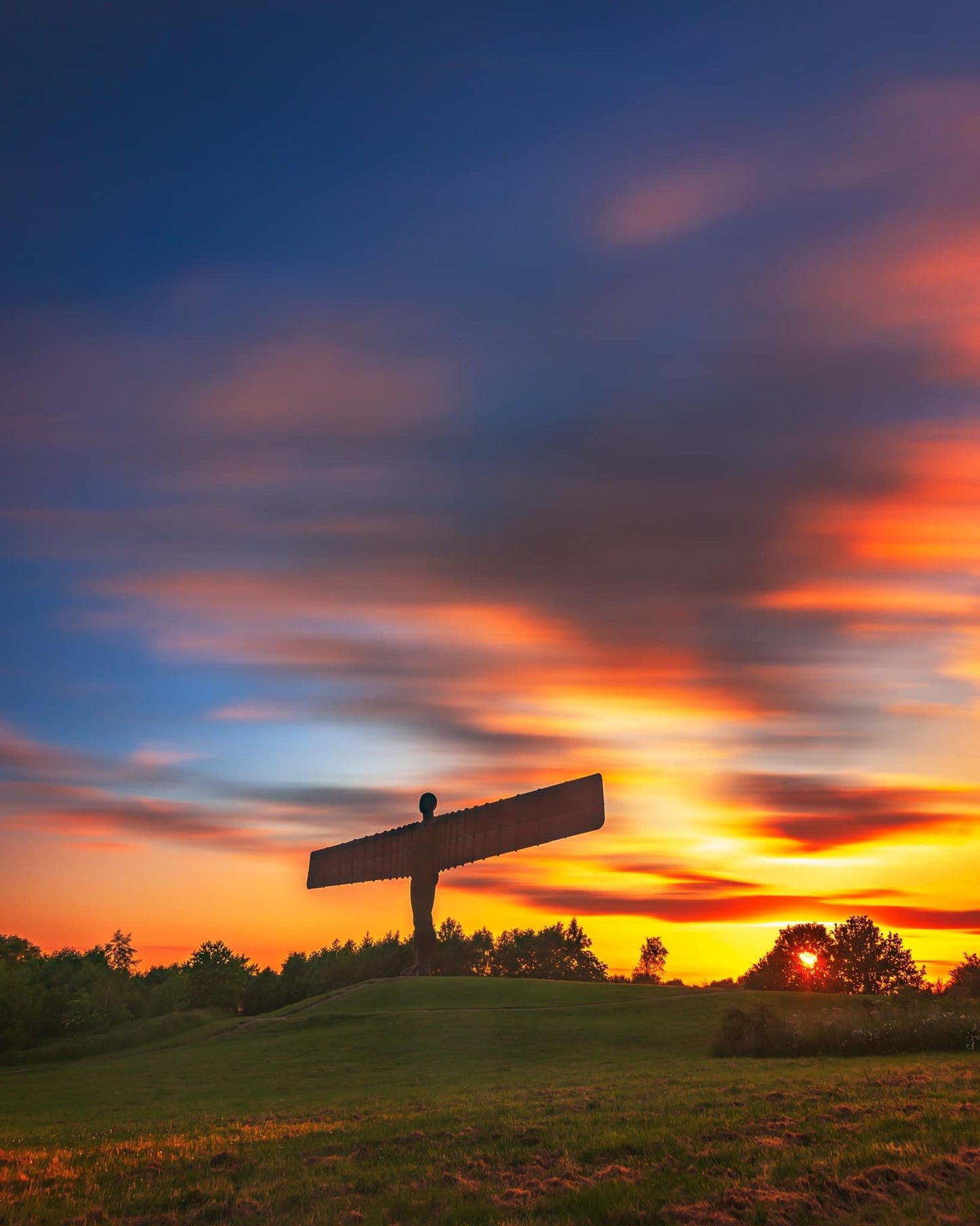 Long exposure of a colourful Angel of the North sunset.