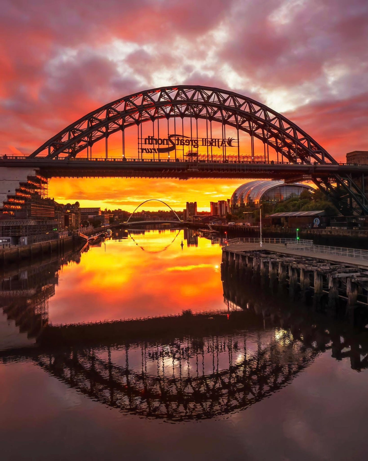 Glowing sunrise sky over Newcastle Quayside.
