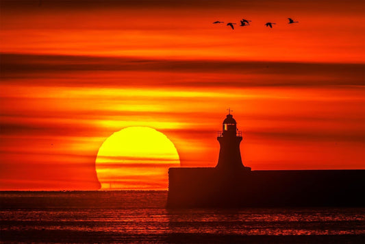 Sunrise by South Shields lighthouse.