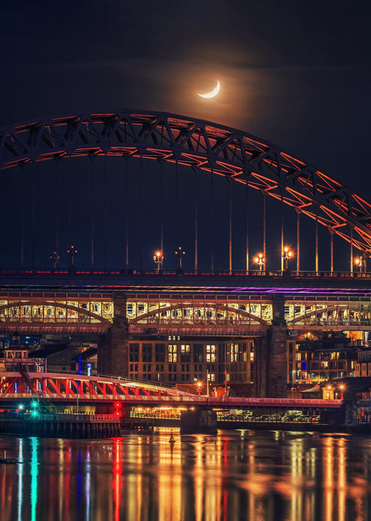A crescent moon above the Tyne Bridge.