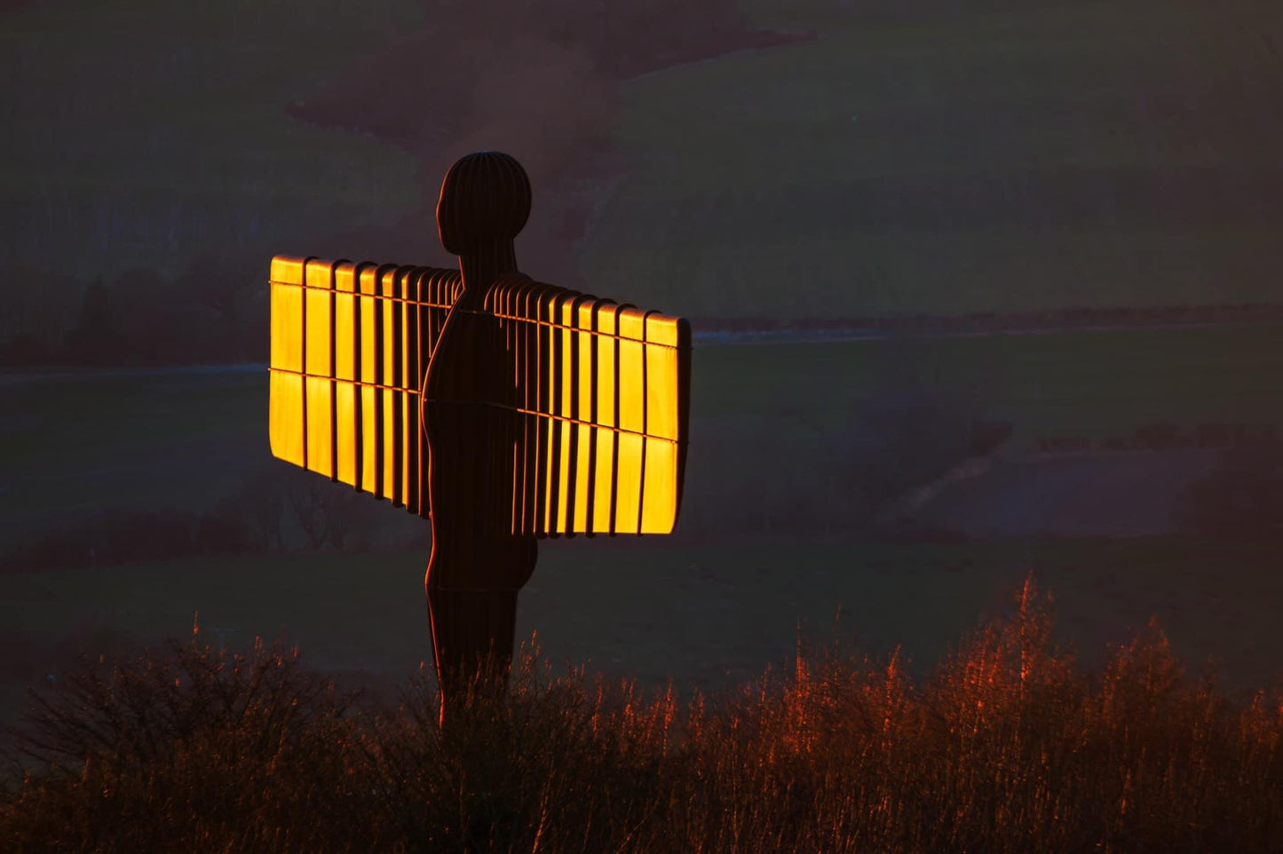 The Angel of the North Gleaming in golden light.