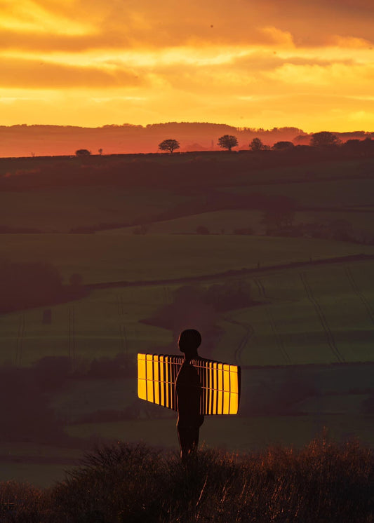 The Angel of the North caught in a glowing sunset.