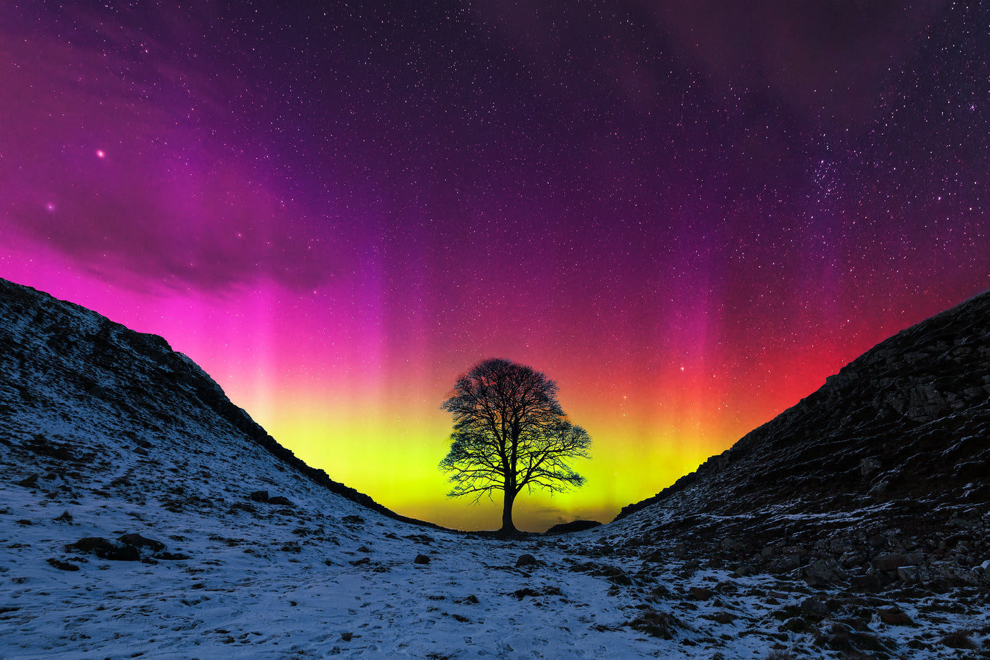 Composite photo of an Aurora at Sycamore Gap.