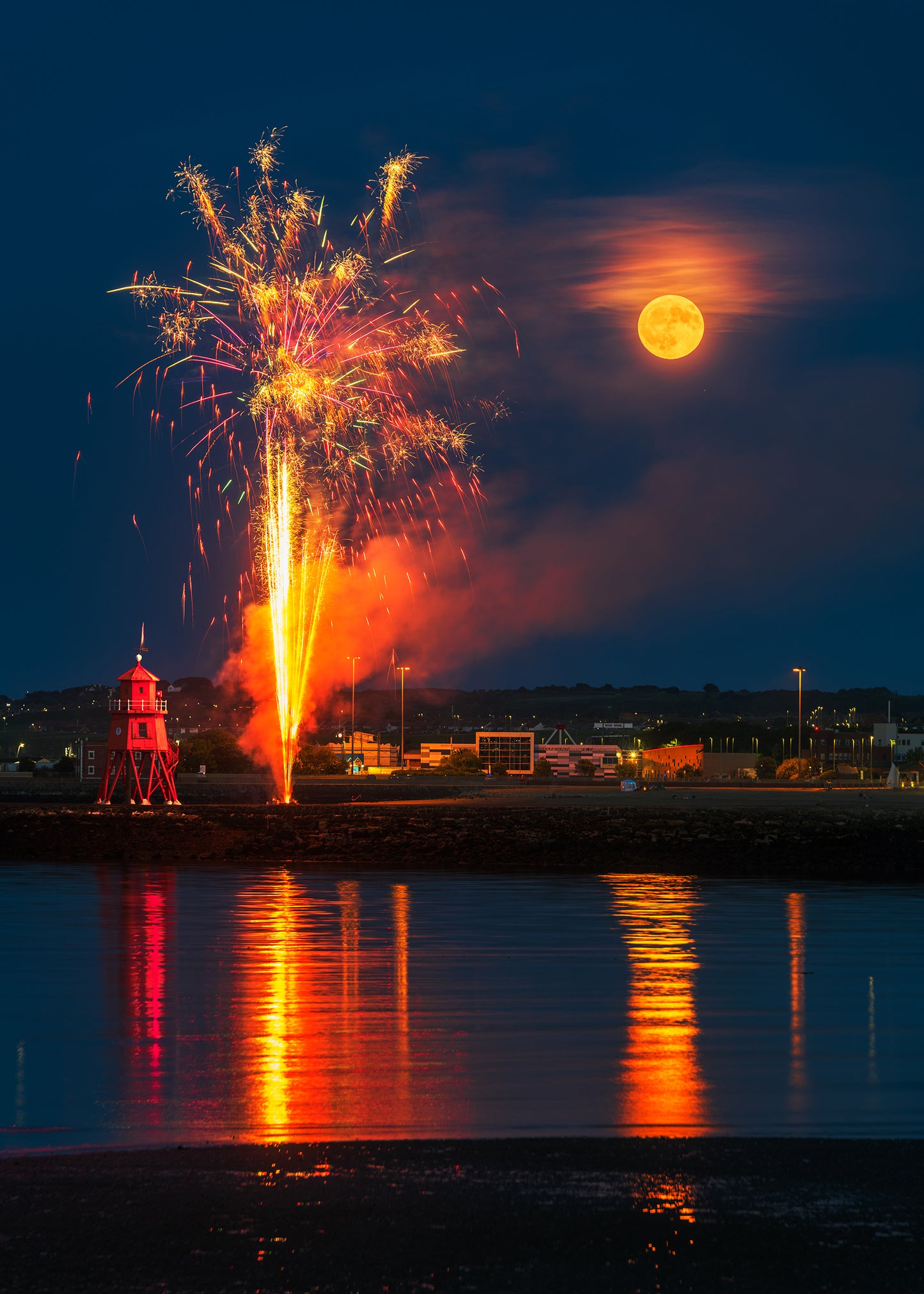 Full moon and fireworks by the Groyne Lighthouse 2