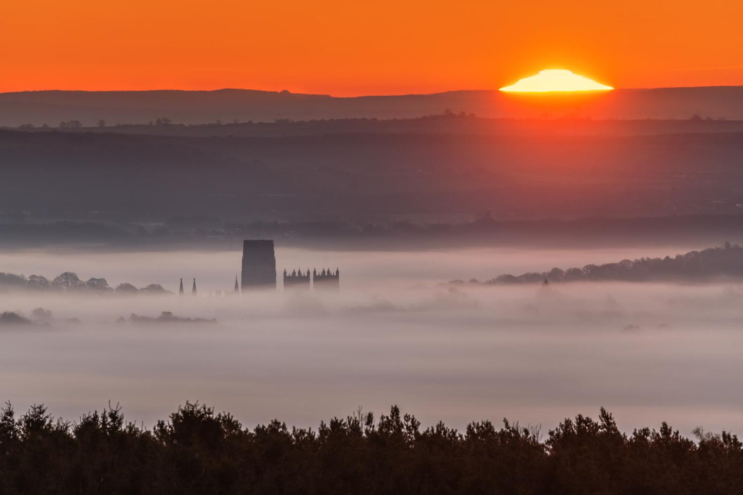 Durham Cathedral buried in the mist at sunrise.